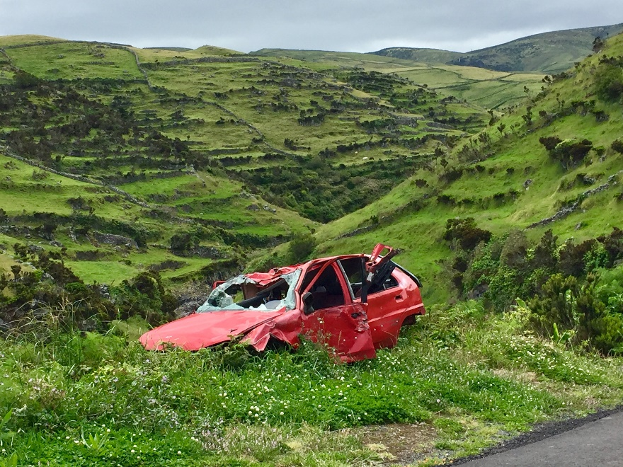 A wrecked car in a field