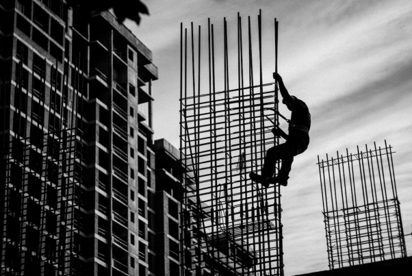 Silhouette of a person on a construction site