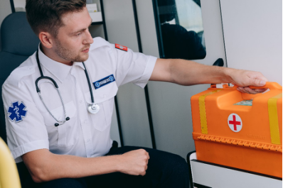 A first responder with a first aid kit