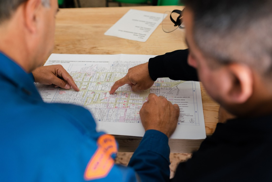 two people studying an evacuation plan