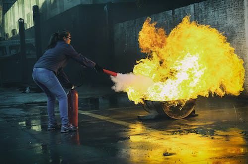 a woman putting out a fire