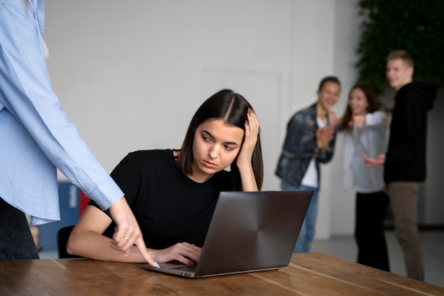 Woman suffering from workplace bullying