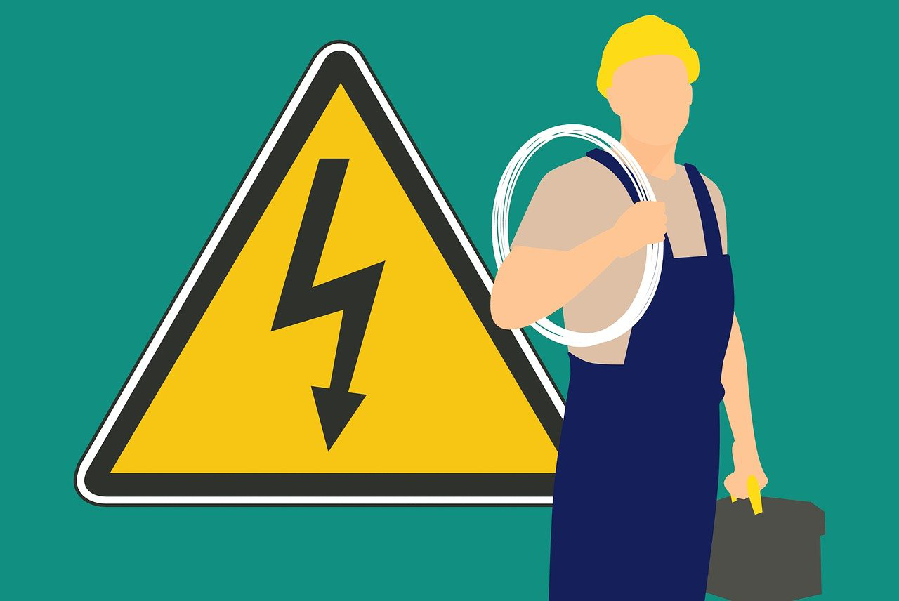 An illustration of an electrician and a hazard sign