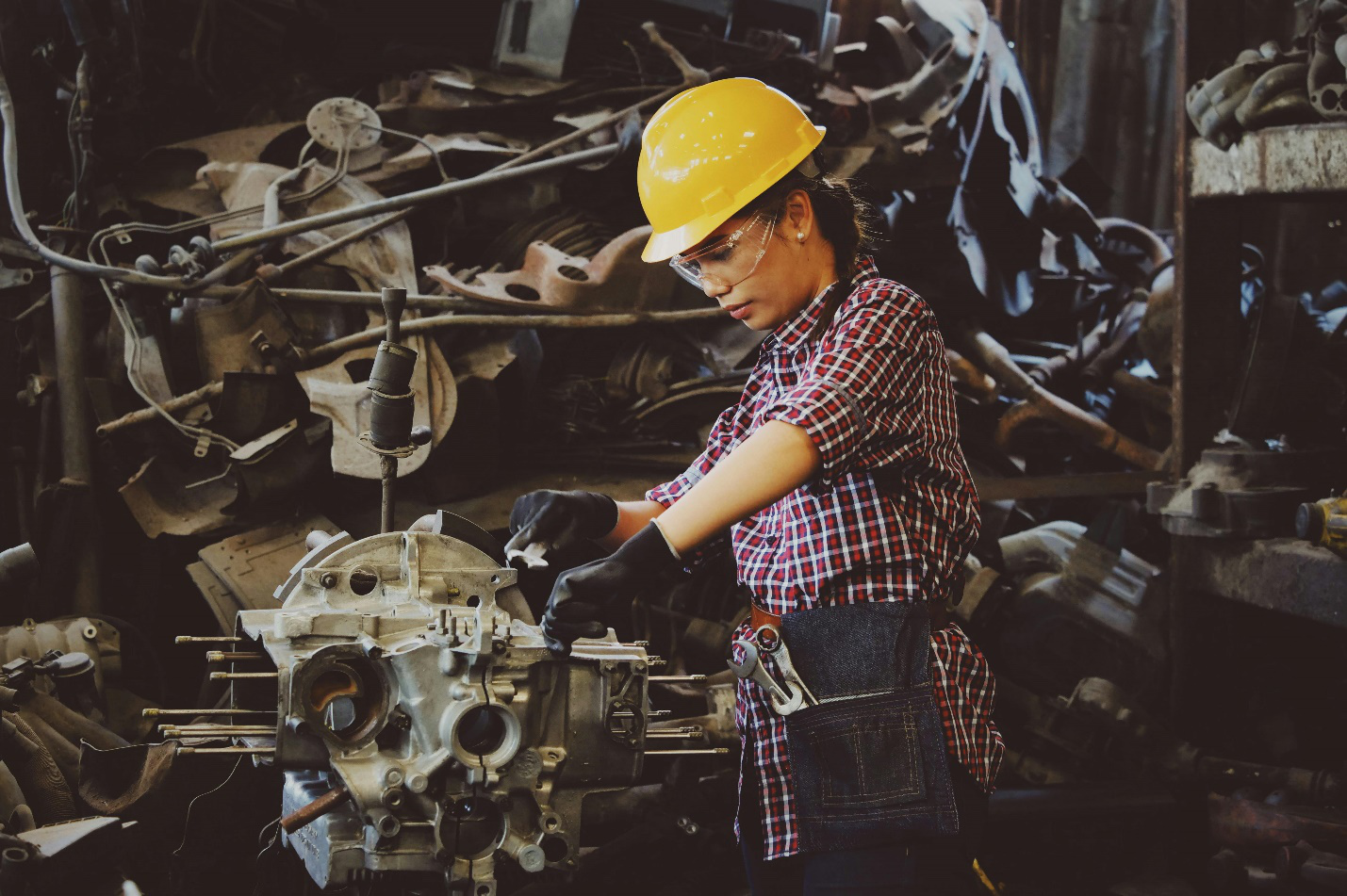 Woman wearing a yellow hard hat, highlighting the importance of head protection