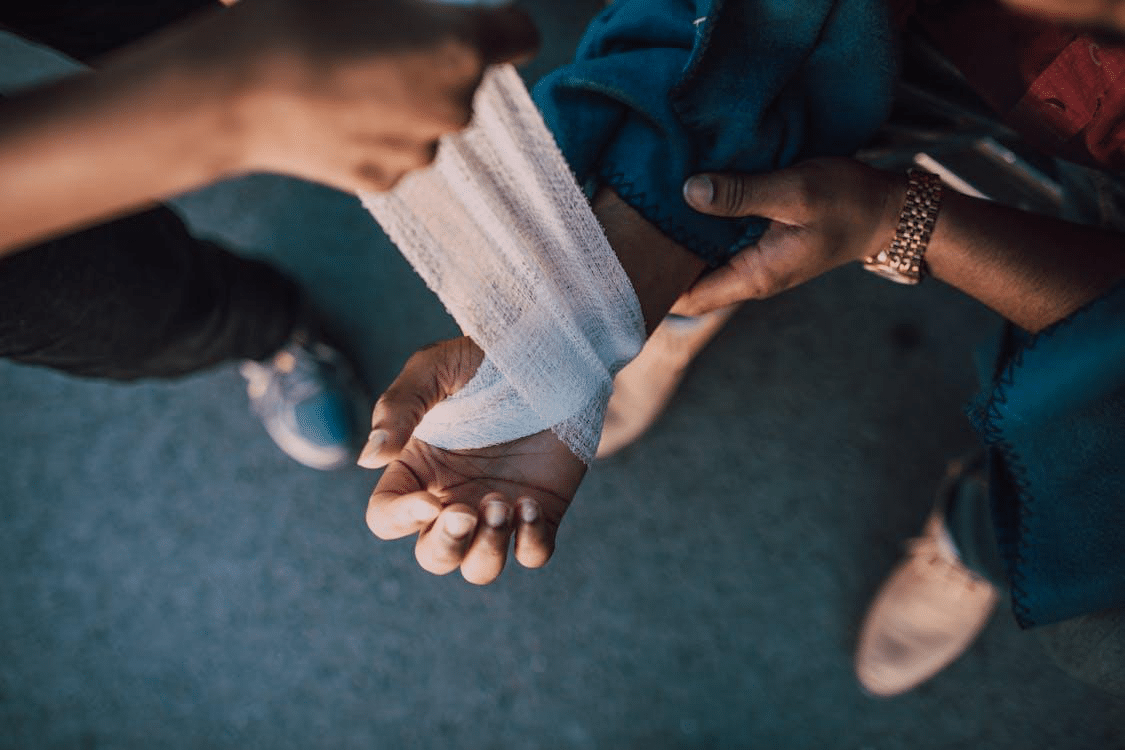 Person applying a bandage