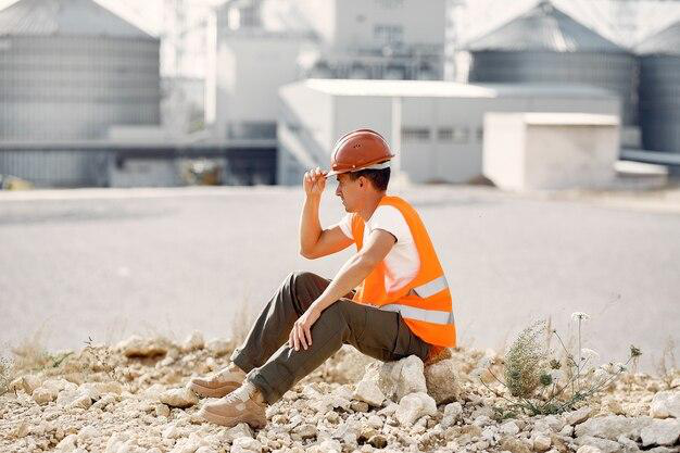 A worker sitting on debris