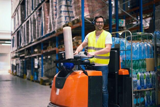 A warehouse manager operating a forklift 