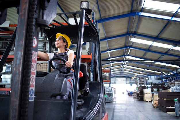 A woman driving a forklift