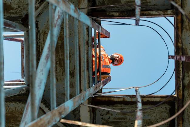 A worker ready to descend stairs